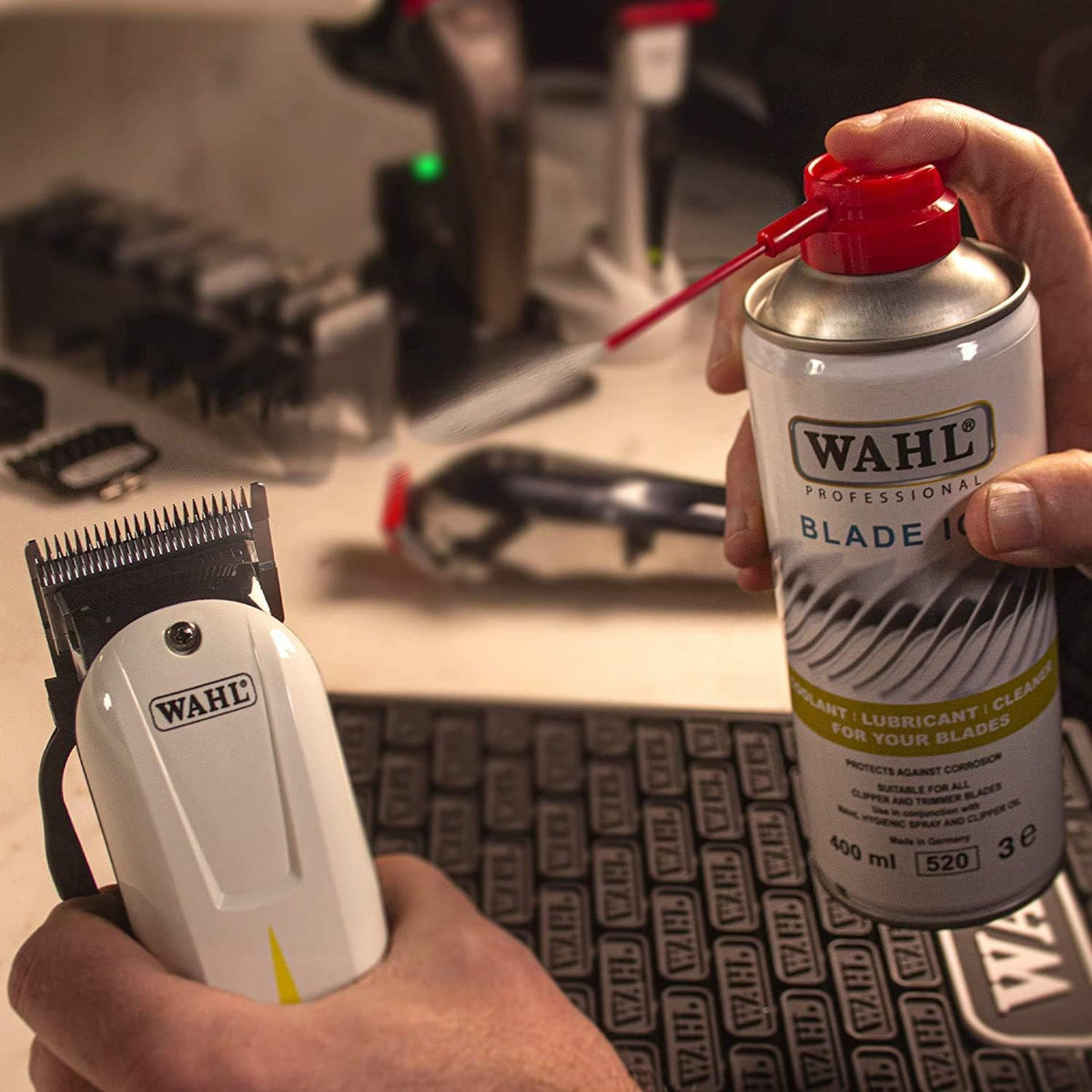 a real in-use photo of the wahl ice blade spray being used on a wahl clipper