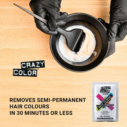 Hair removal product with a brush and container on a wooden surface, featuring the brand 'Crazy Color'.