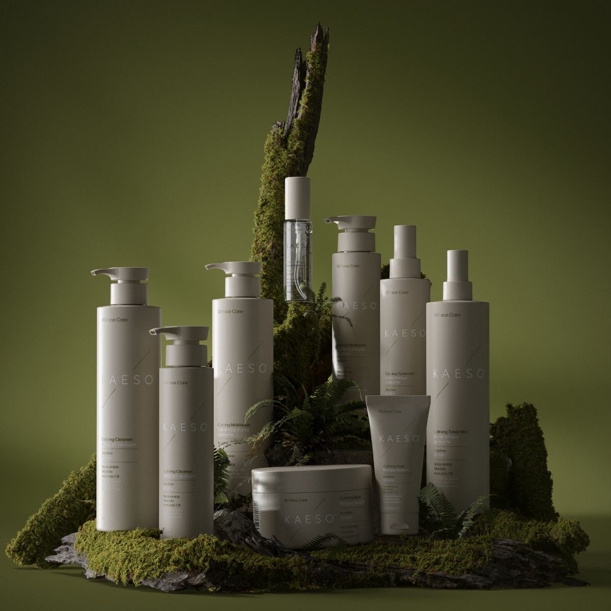A collection of white and clear skincare bottles and tubes from the brand CAESAO, styled on a mossy base with a tree trunk prop against a dark olive green background.