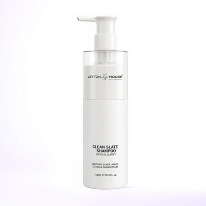 A bottle of Leyton House Clean Slate Shampoo with a white pump dispenser and a clear cap, set against a clean white background with a subtle purple gradient.
