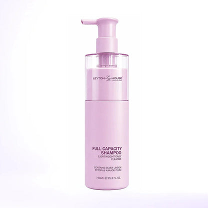 A bottle of Layton's House Full Capacity Shampoo in a soft pastel pink color, featuring a matching pink pump dispenser, set against a clean white background with a subtle lavender tint.