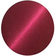 Circular swatch of deep garnet-red gel polish with fine shimmer and a bright pink diagonal stripe, on a white background