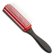 A 7-row styling brush with firm nylon bristles, a black handle, and a red top.
