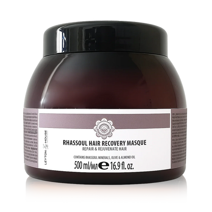 A 500 ml jar of Rhassoul Hair Recovery Masque by Leyton House, featuring a dark amber-brown translucent container, a black lid, and a white label with mauve accents.