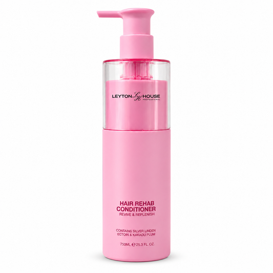 A bottle of Leyton House Hair Rehab Conditioner in a vibrant pink color, featuring a matching pink pump dispenser and a clear upper section showing the pink liquid inside, set against a plain white background.