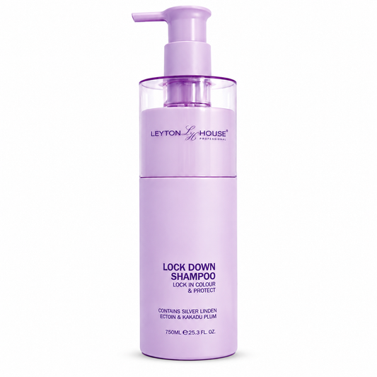 A 750ml bottle of Leyton & House Professional Lock Down Shampoo in a light lavender purple color, featuring a matching pump dispenser on a clean white background.