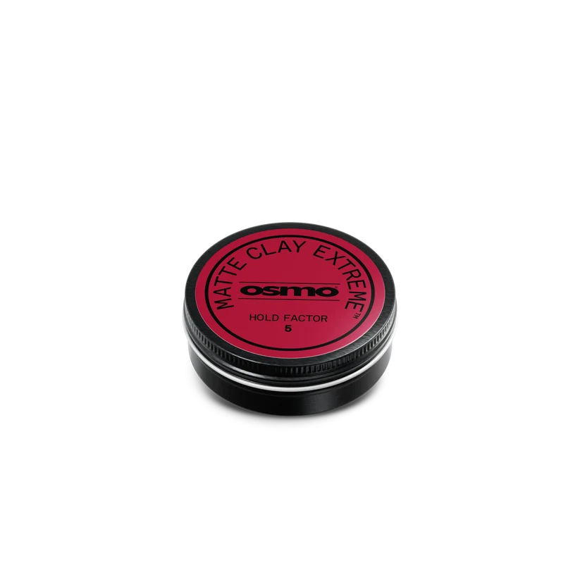 A round black tin of Osmo Matte Clay Extreme Hold Factor 8, featuring a vibrant red circular label, set against a solid white background.