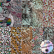 A collection of nail art foils with various animal print designs, including leopard and zebra patterns, and texturaed foils with metallic and holographic finishes.