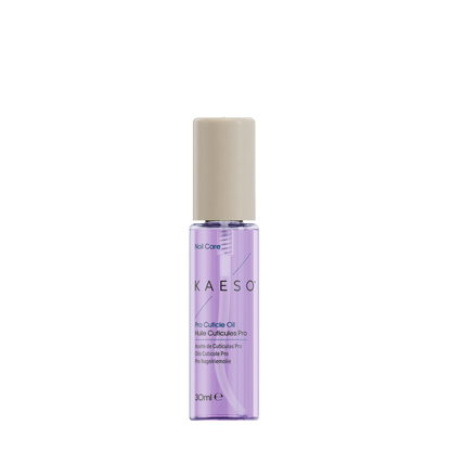KAESO nail care Pro-Cuticle Oil in a clear cylindrical bottle with light purple liquid and a beige cap, shown on a plain white background.