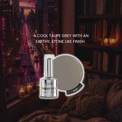 A bottle of halos 'superRICH' gel nail polish in the shade 'Nook' is shown with a matching circular color swatch. The background is a cozy, dimly lit room with a window overlooking a city street at dusk, with warm candlelight and a bookshelf.