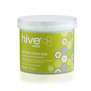 A pot of Hive Tea Tree Crème Wax, 425g size, with green and white color scheme and hexagonal patterns.
