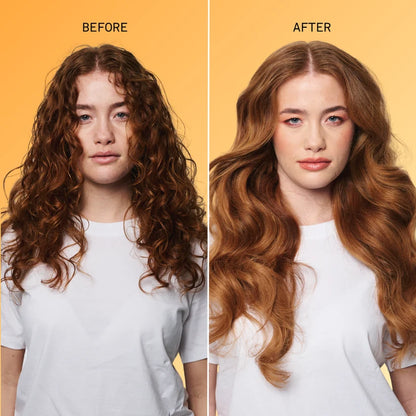 Before-and-after hair transformation showing a woman with curly brown hair on the left and long, wavy auburn-brown hair on the right, set against a solid yellow-orange background.
