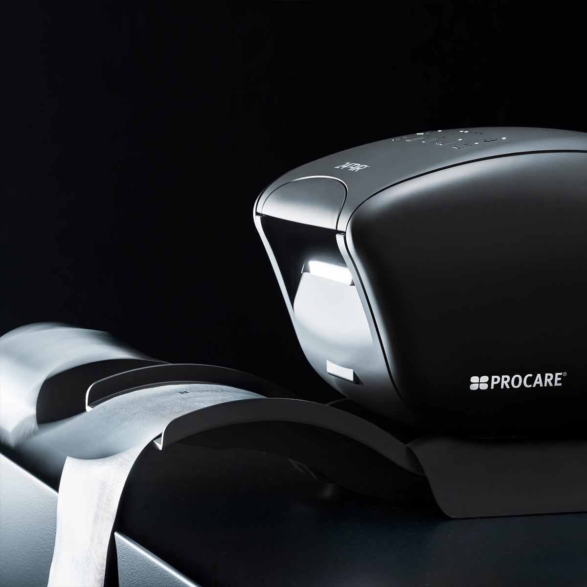 Black and silver Procare device on a black background procare foil dispenser 247 