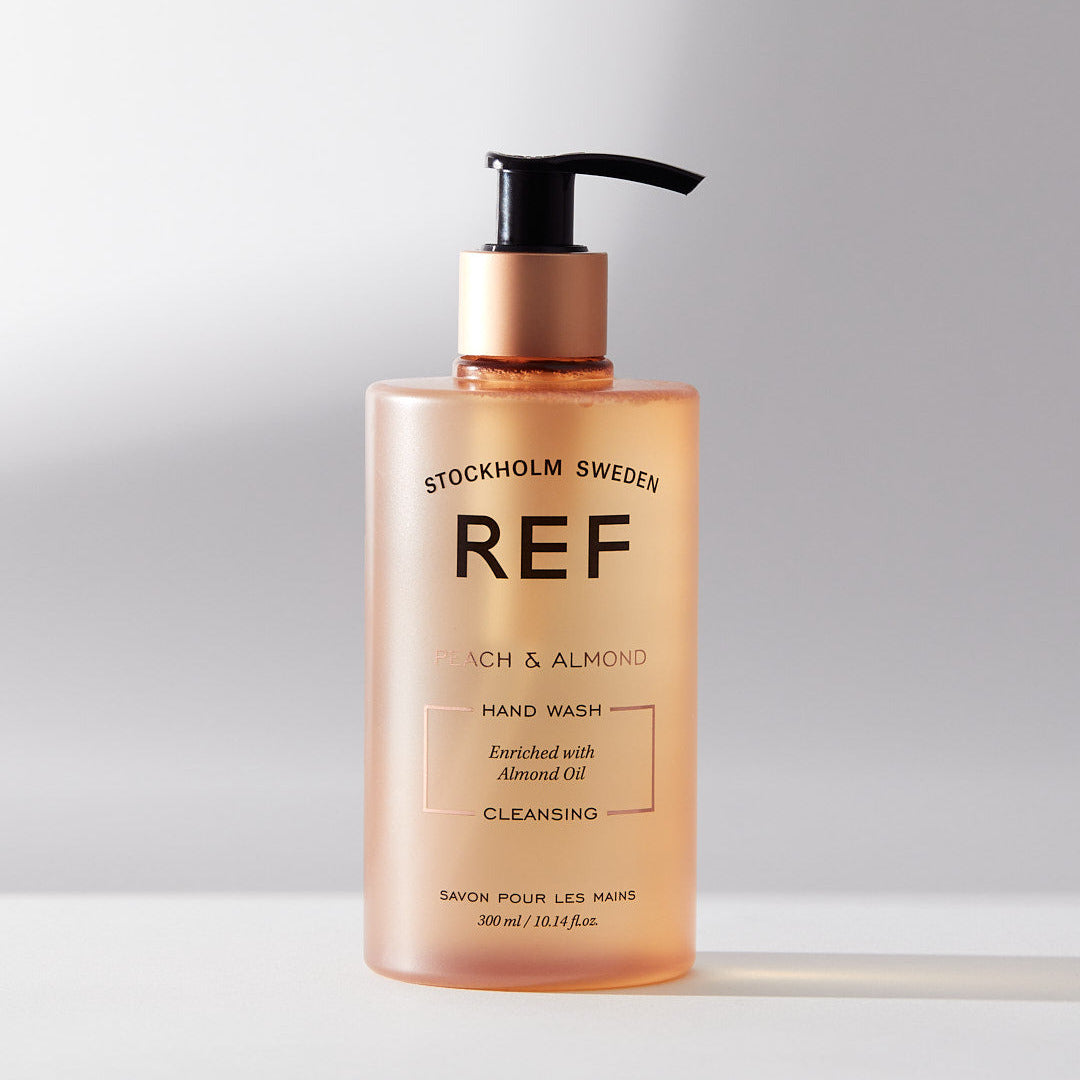 Hand wash bottle with 'REF' branding on a light background