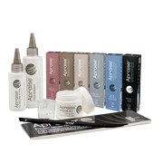 A collection of Aprise hair extension products, including two white bottles with silver applicator tips, several colored boxes in pink, brown, beige, gray, blue, and black, a white jar with its lid off, a small clear mixing cup, and black-and-white instruction sheets on a plain white background.