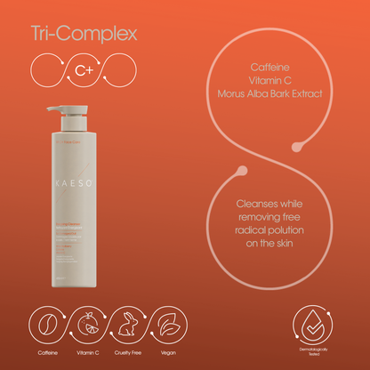 KAESO Tri-Complex C+ serum bottle on a warm orange gradient background with product ingredients and feature icons.
