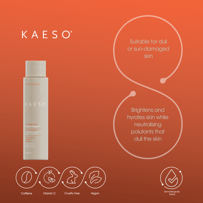 KAESO Vitamin & Care Brightening Cleanser bottle on a warm orange gradient background with product benefits and icons displayed.