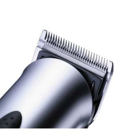Close-up of a silver electric hair clipper showing the metal cutting comb and body against a white background.