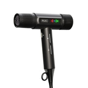 A black Wahl Vanquish hair dryer with a digital display, attachments, and a power cord.