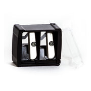 A black cosmetic pencil sharpener with a double hole design and a transparent cover on top, placed on a white surface.