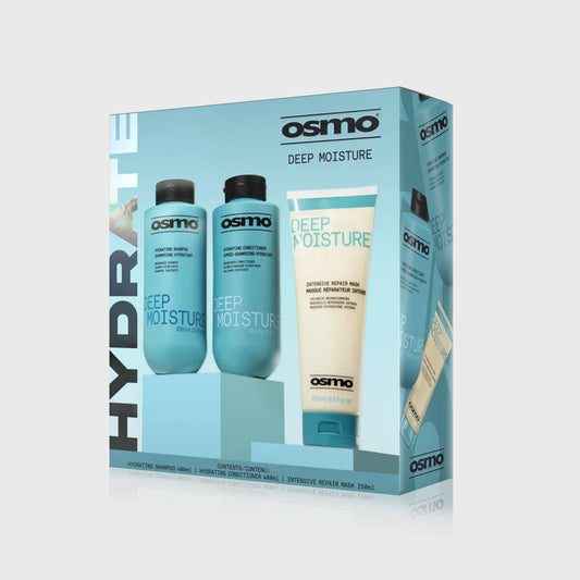 Osmo Deep Moisture hair care gift set in a light blue box, containing two blue bottles and a cream-colored tube, shown on a light gray background.