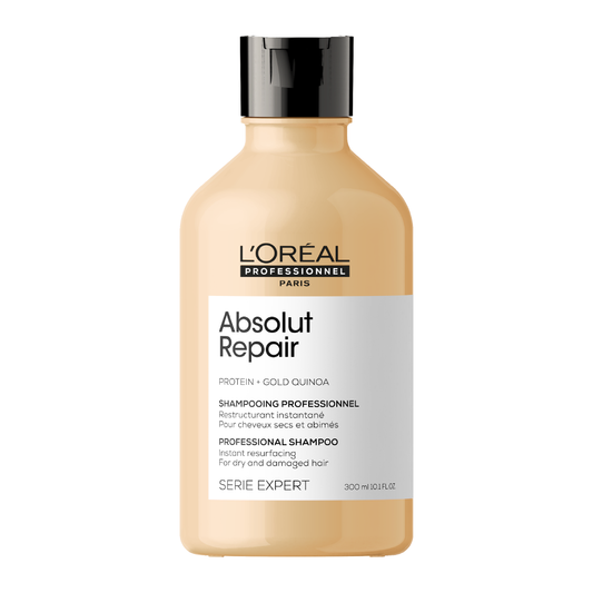 A bottle of L'Oréal Serie Expert Absolut Repair Shampoo with a beige label on a white background.