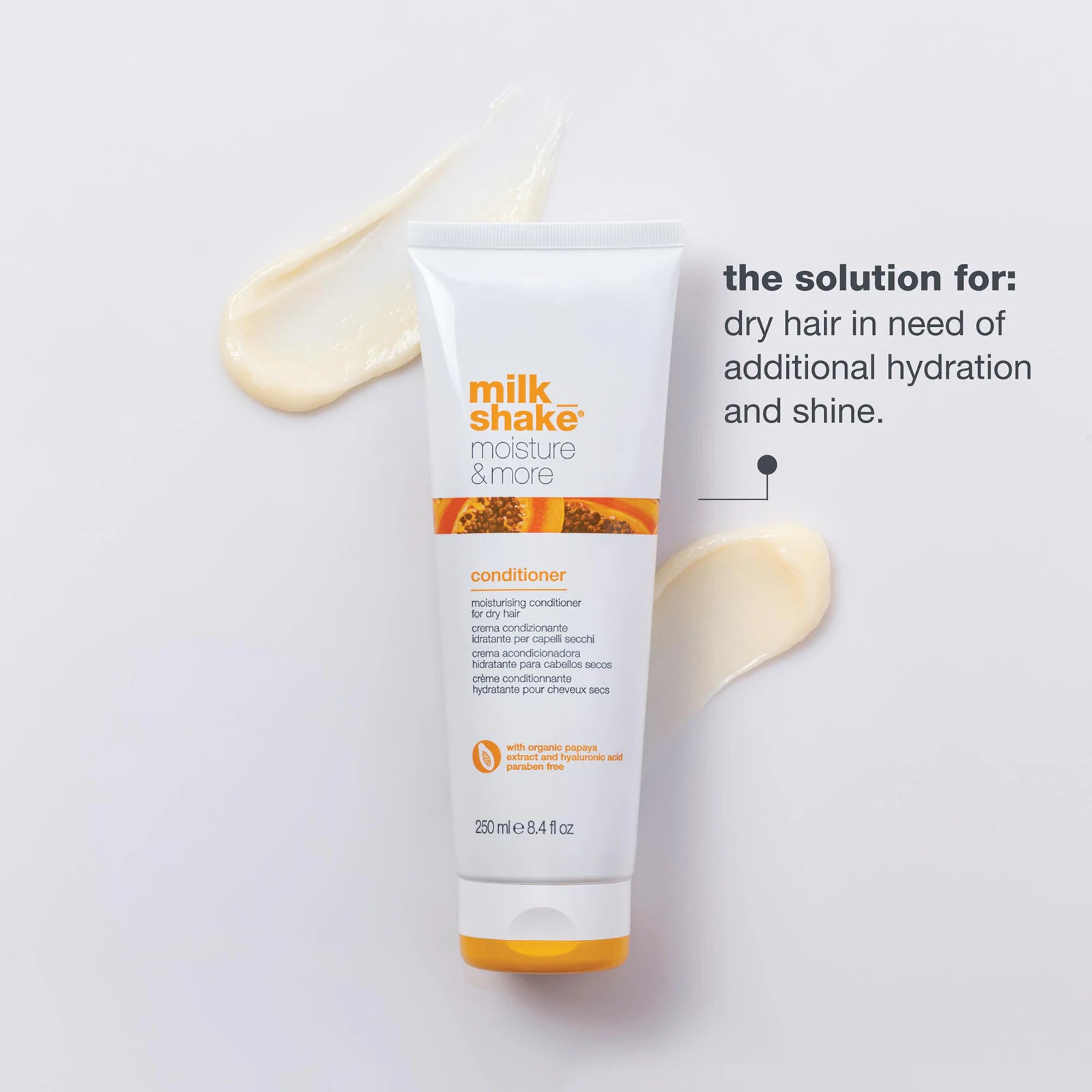 Milk Shake conditioner bottle on a light background with text about dry hair needs.