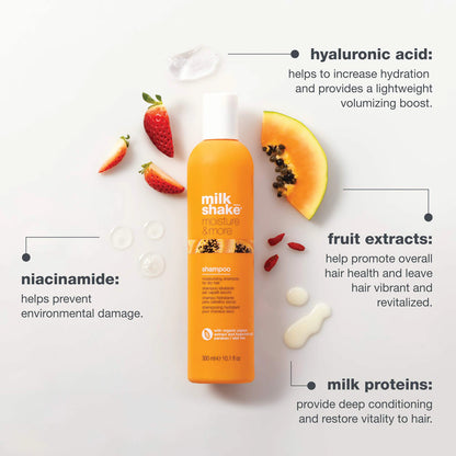 Orange shampoo bottle with fruit extracts on a light gray background