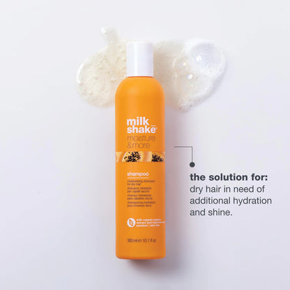 Orange shampoo bottle with 'milk shake' branding on a white background