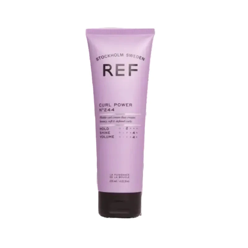 Purple hair care product tube curl power with 'REF' branding on a white background