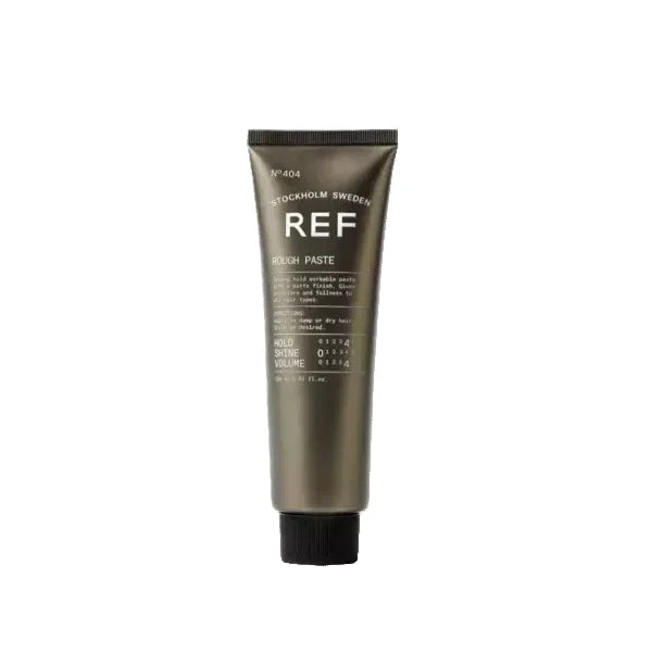 Tube of REF rough paste hair product on a white background
